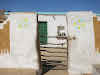 India. Rajasthan Thar Desert Camel Trek. Neat house and entrance yard