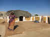 India. Rajasthan Thar Desert Camel Trek. Old lady by her summer house.