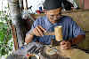 Indonesia. Crafts . Punching holes in buffalo skin