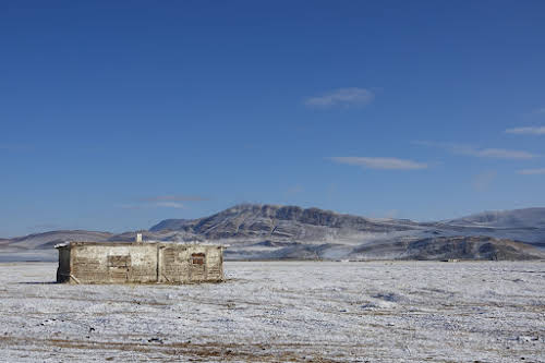 Winter house under the first snow of the winter