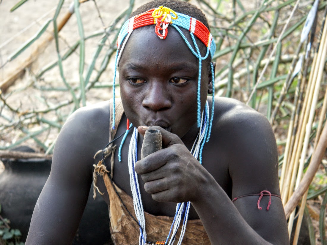 Hadzabe hunter smoking